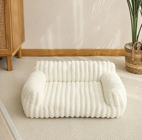canape pour chien blanc en velours cotele avec rebords rembourres