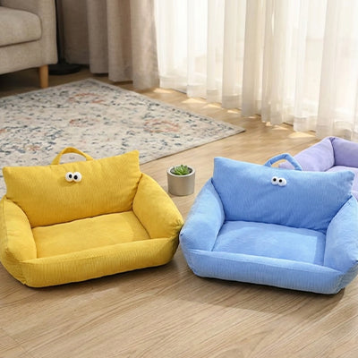 canape pour chien jaune et bleu en velours cotele avec dossier yeux decoratifs