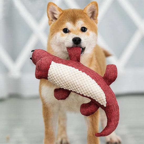 doudou pour chien shiba inu portant crocodile rouge